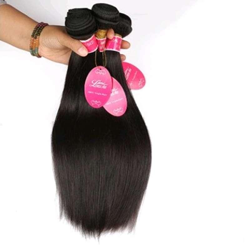 Premium human hair bundles with 4x4 straight wave lace closure held in hand showing quality