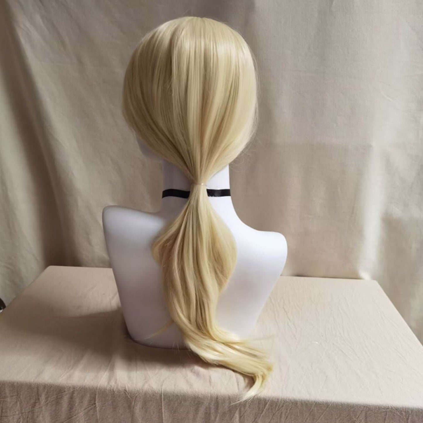 Layered blonde wig showcasing dimensional cut with face-framing layers and movement