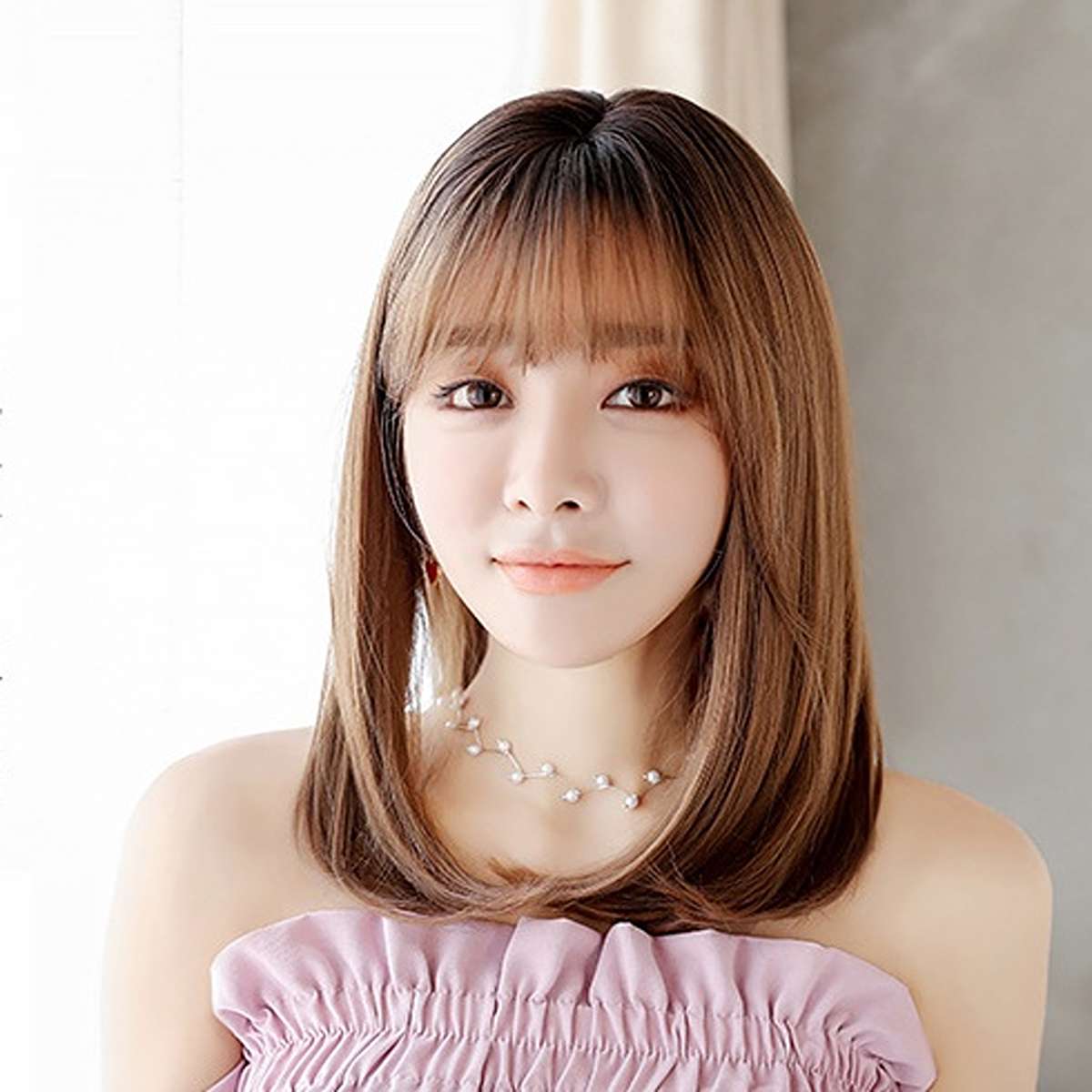 Brown shoulder-length straight wig with bangs showing natural texture and comfortable everyday styling option