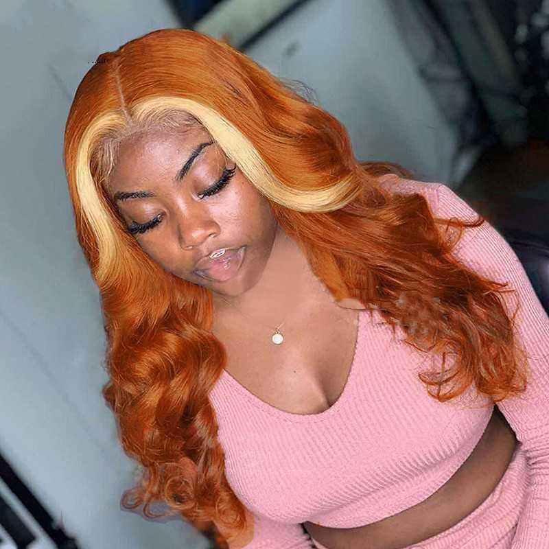 Long wavy honey blonde human hair wig with warm orange undertones and natural volume