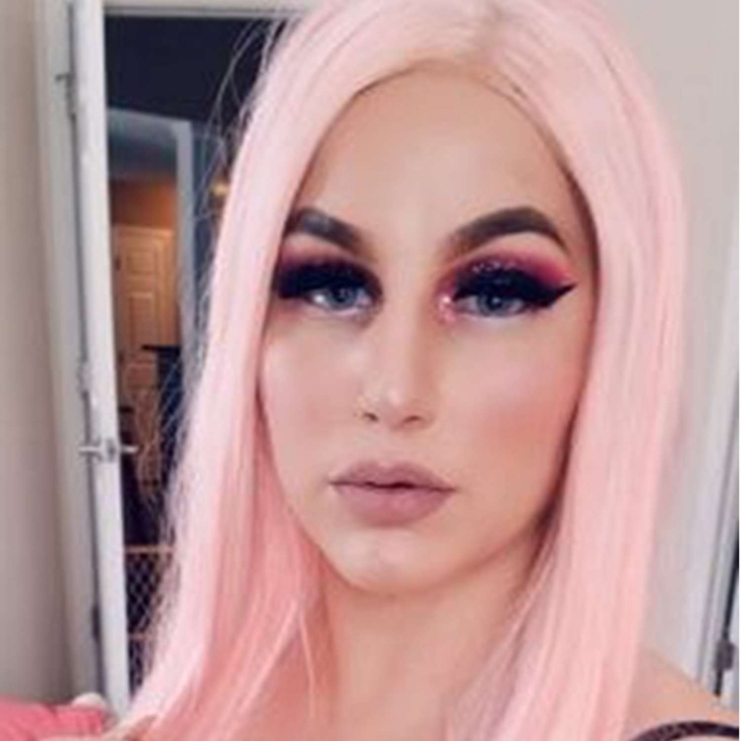 Model showcasing vibrant colored extra long straight hairpiece with professional makeup and styling
