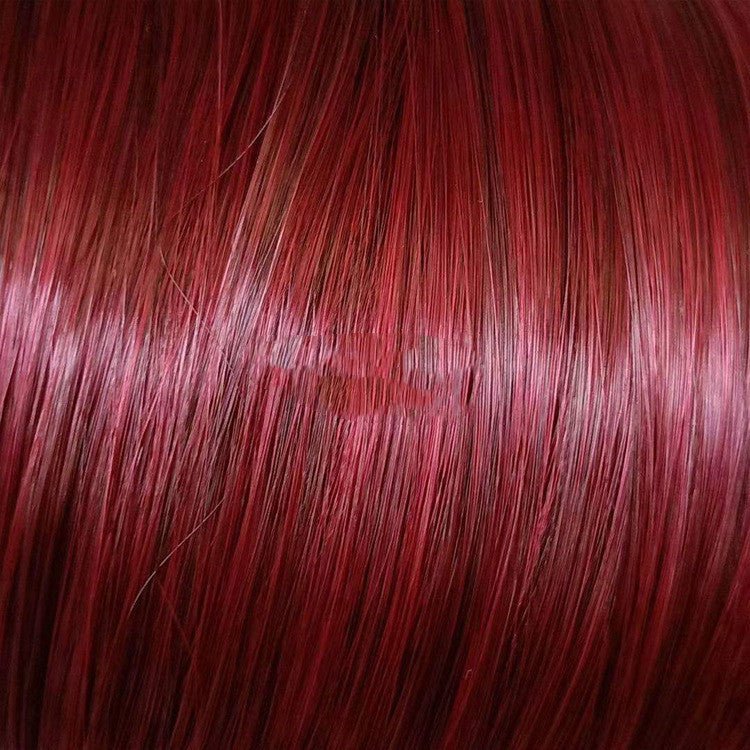 Red-brown hair strands texture close-up detail showing natural wave pattern and color variation quality