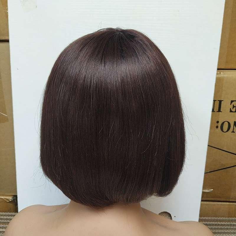 Short bob wig with dark brown straight hair on mannequin, salon display background