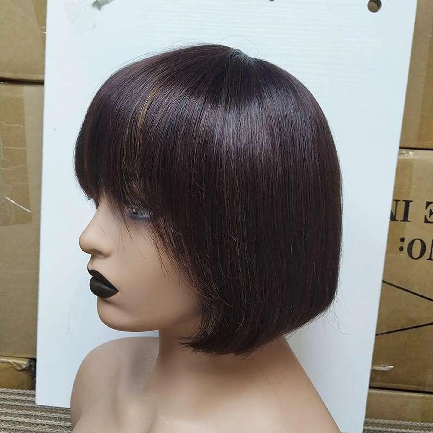 Natural black bob wig human hair straight bangs pre-plucked heat resistant 180C closeup detail